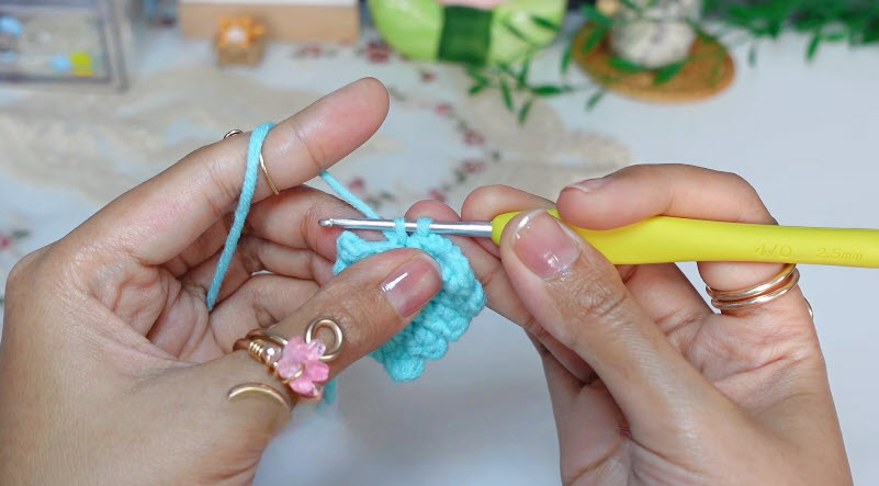 Crochet stitches forming flower base