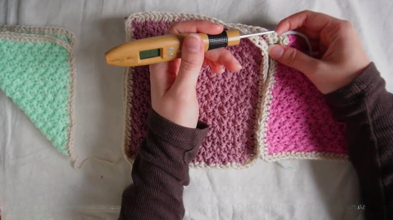 Joining colorful crochet triangle patches together