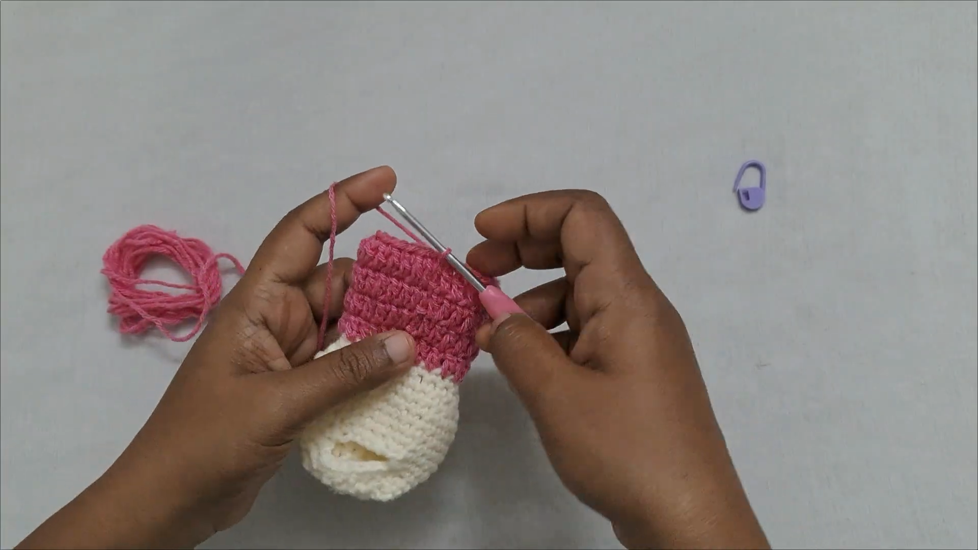 Pink crochet rows added on cream keychain base