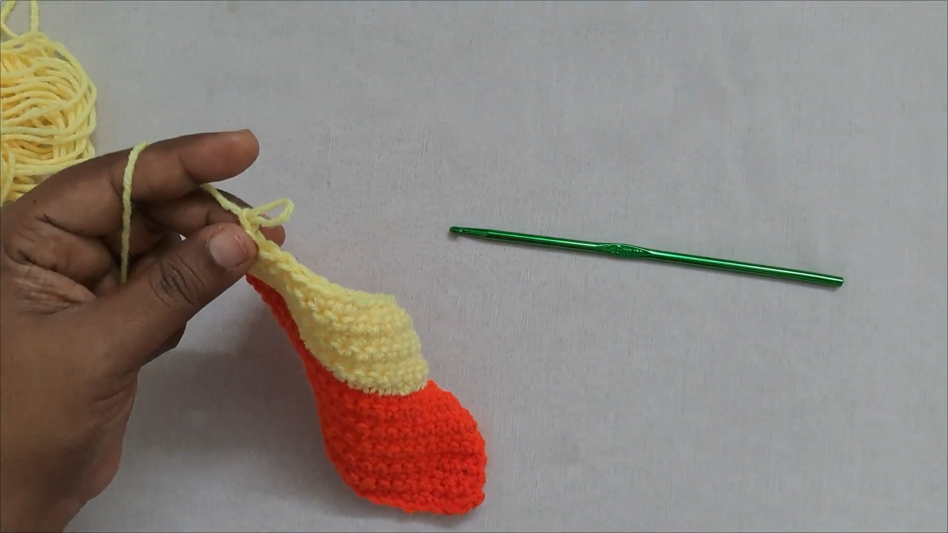 Red and yellow crochet car purse shape