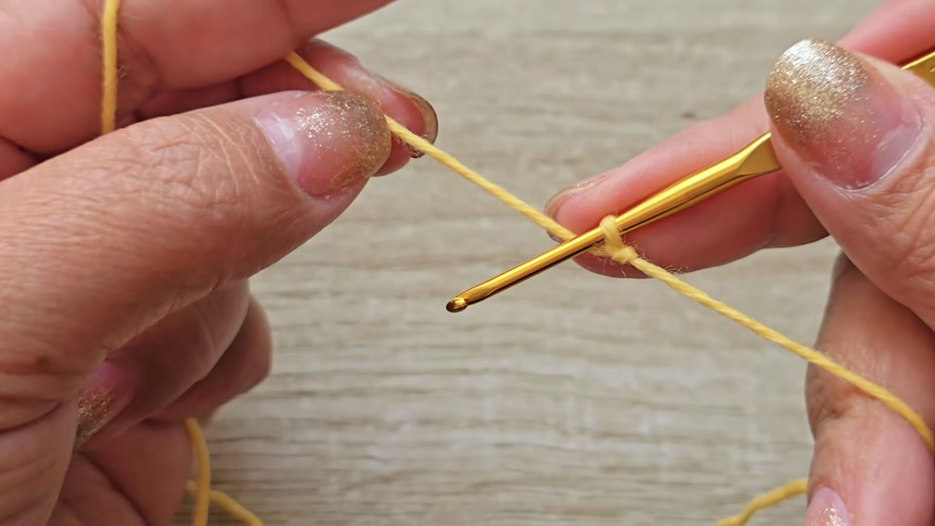 Slip knot with yellow yarn for butterfly pattern
