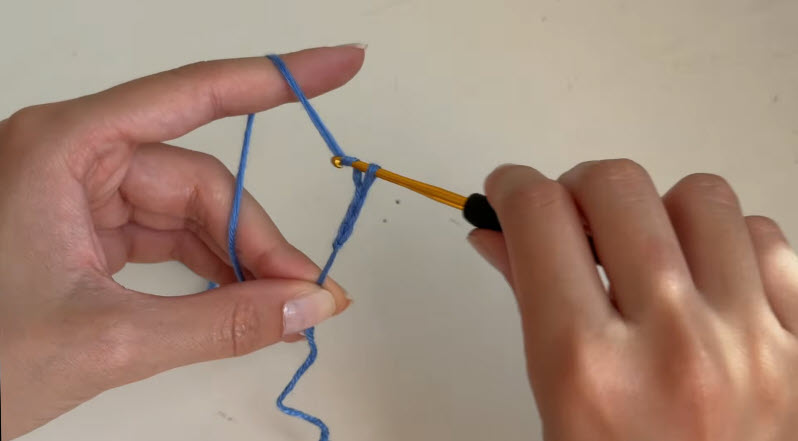 Starting chain stitches with blue crochet yarn