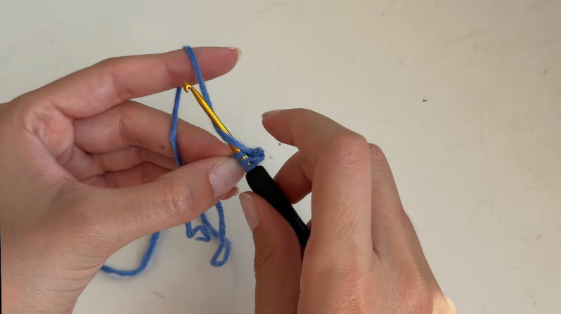 Working stitches with gold crochet hook
