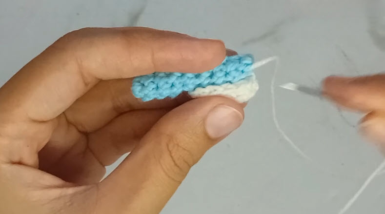 Blue and white toothbrush bristles crochet piece