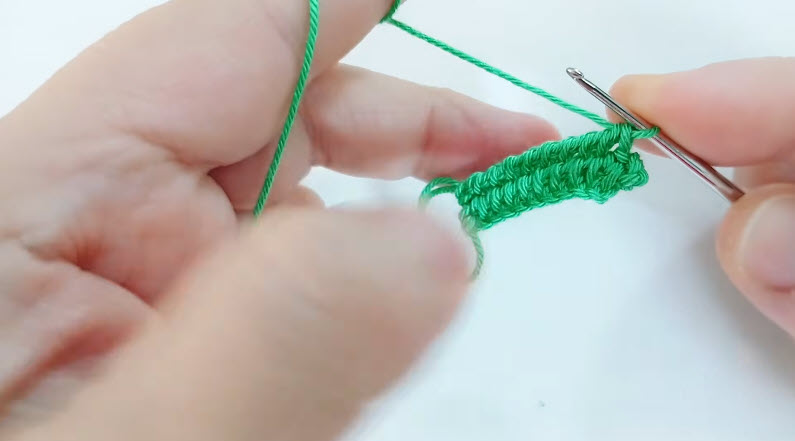Building petal row in crochet flower earring design