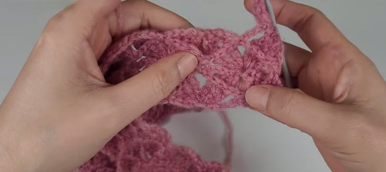 Close-up of the finished shell stitch texture on the cardigan piece