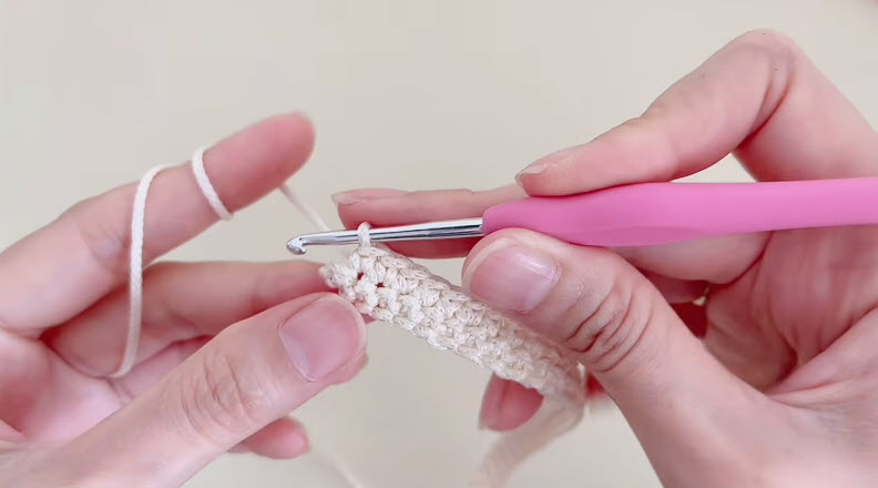 Cream single crochet fabric taking shape for rabbit bag