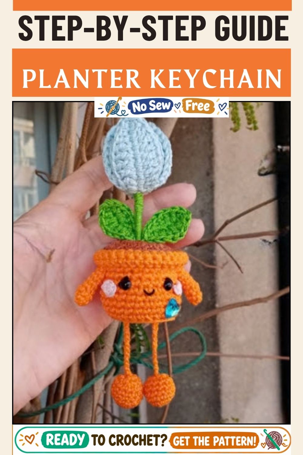 Finished crochet baby planter keychain with a tulip in brown soil.