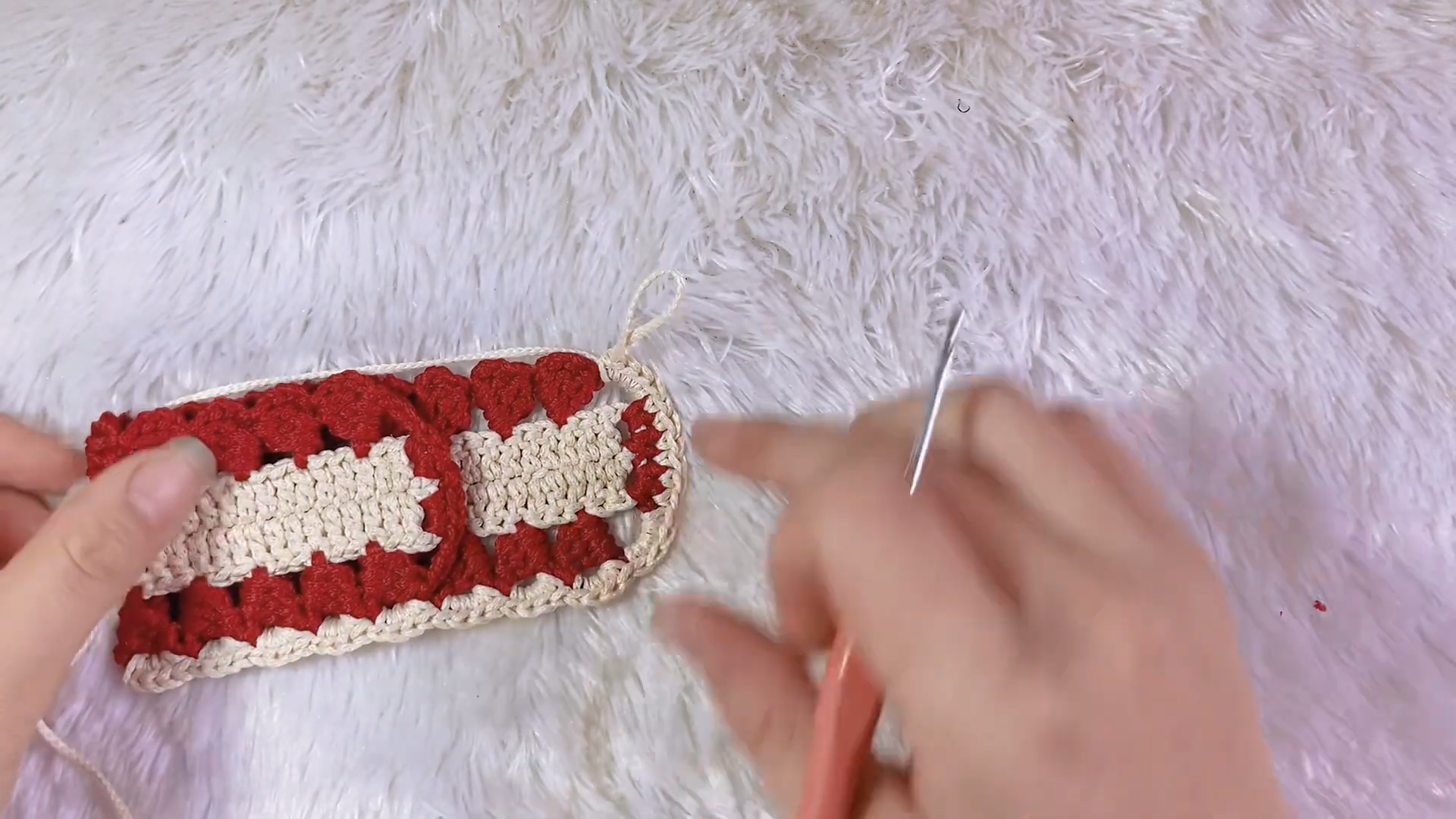 Finished red and cream crochet keychain purse with loop