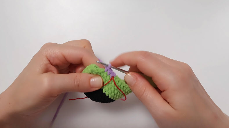Green face rounds with purple yarn joined