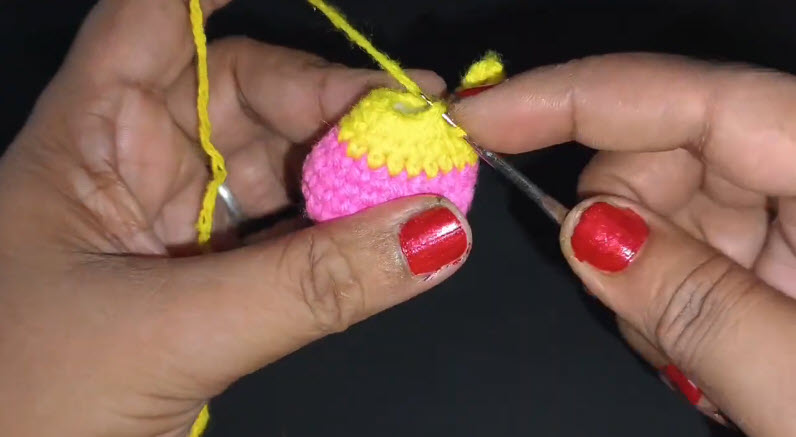 Making a slip stitch to finish yellow section