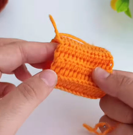 Ribbed crochet rectangle shaped into a tube for the pumpkin body