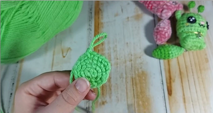 Small green amigurumi piece ready before questions segment
