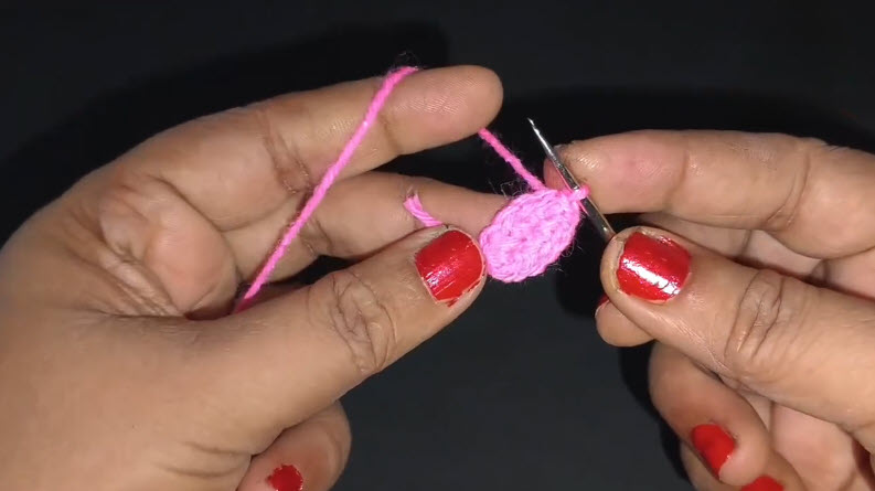 Small pink crocheted oval starting the mini owl