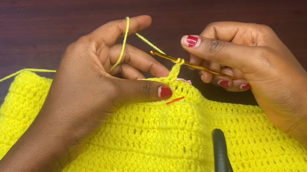 Yarn rejoined beside a stitch marker