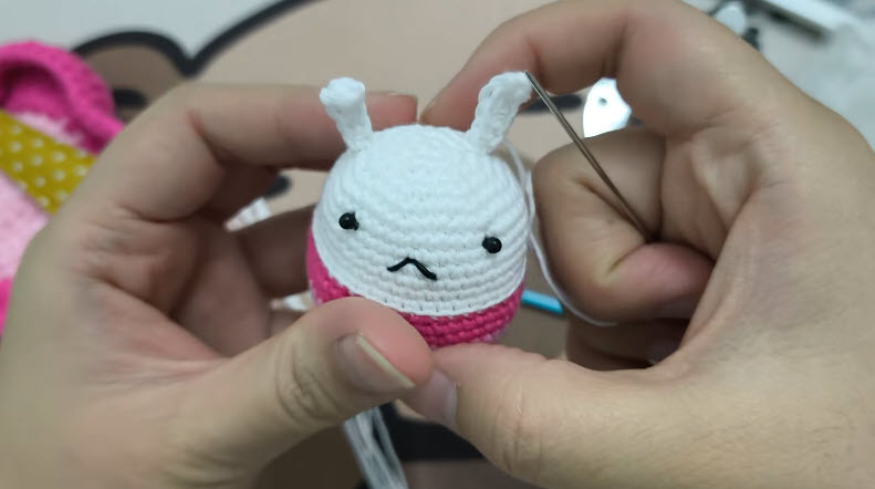 White ears sewn on the finished bunny