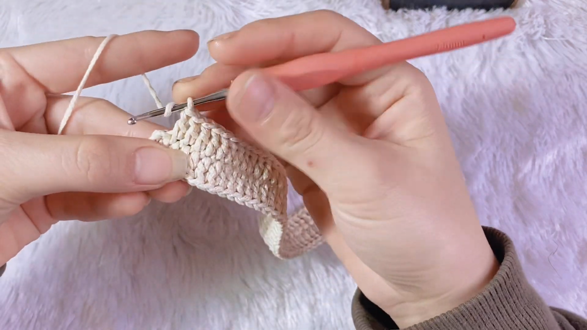 Working single crochet rows along the purse base panel