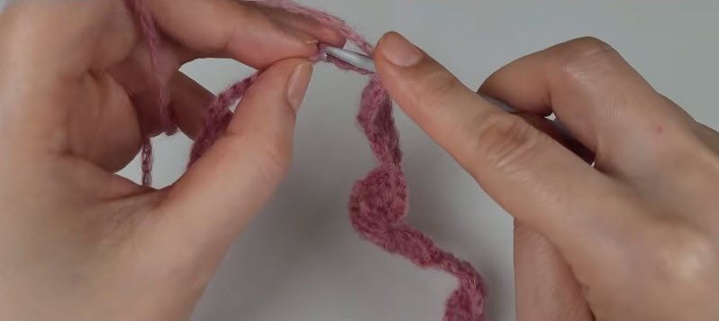 Working the initial chain stitches for the double-sided crochet cardigan