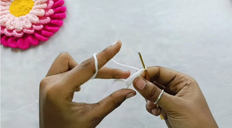 Working treble crochet stitches inside magic circle ring