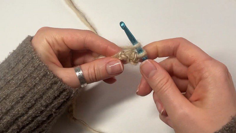 Ruffled crochet fingerless mittens pattern first chain stitches made with a teal hook