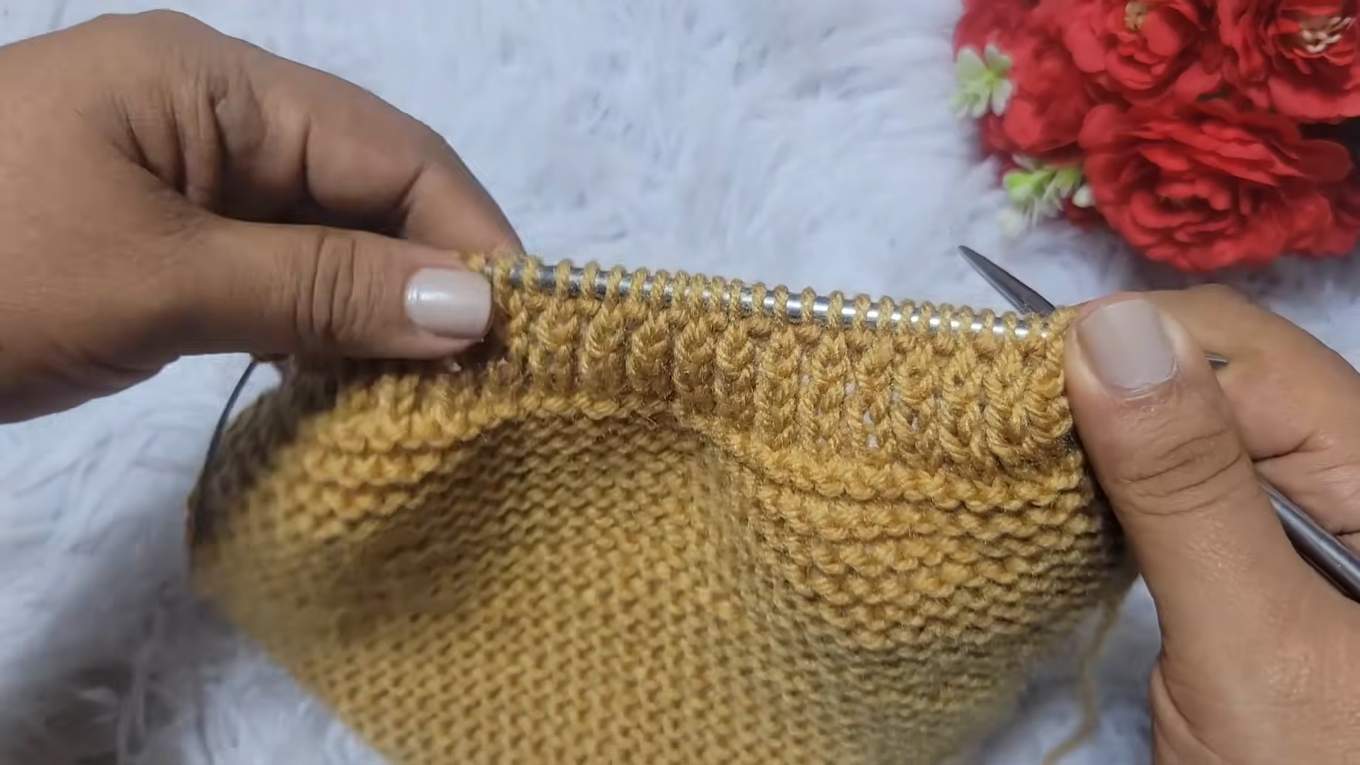 Ribbed edge worked along the top of the mustard knitting.