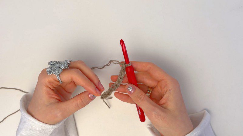 Starting chain worked with a red crochet hook.