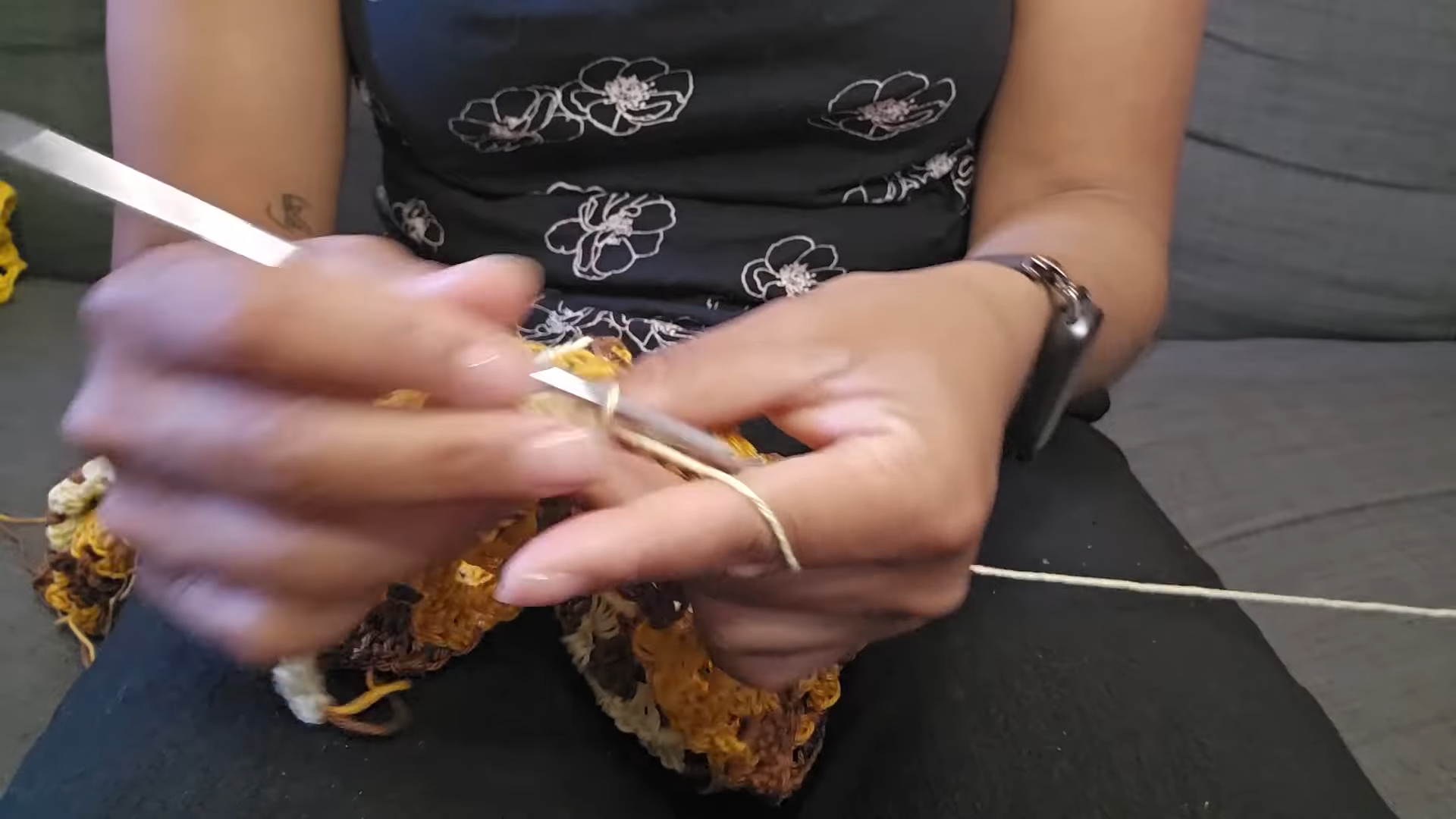 Working a cream edge with a silver hook on the granny piece.